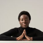 thoughtful african american woman in black turtlen 2026 01 06 00 07 00 utc
